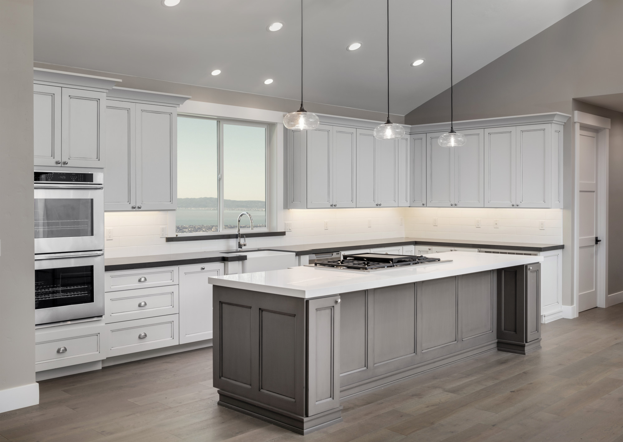 Kitchen with two tone white and grey cabinets